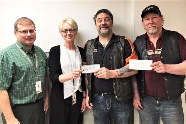Pictured from left are Curt Gullett, DRHC Director, Jean Ann Fisher, DRHC Care Team Manager, John Dulewich and Tony Shewchuk. 